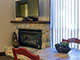 Studio sleeping area + cozy fireplace